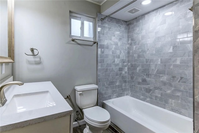 full bath featuring shower / tub combination, visible vents, toilet, and vanity