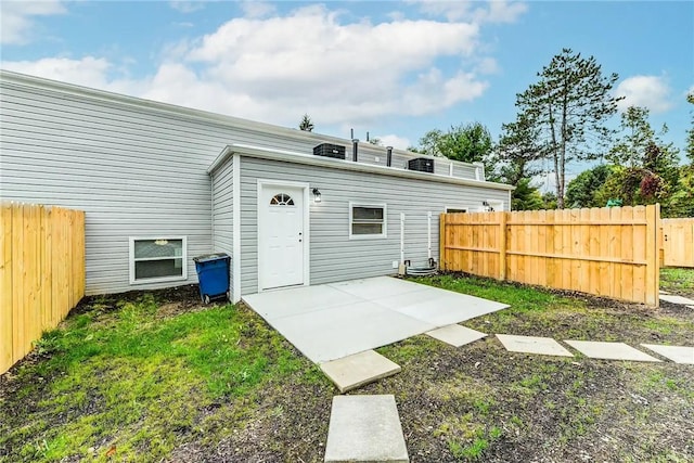 view of outbuilding featuring fence
