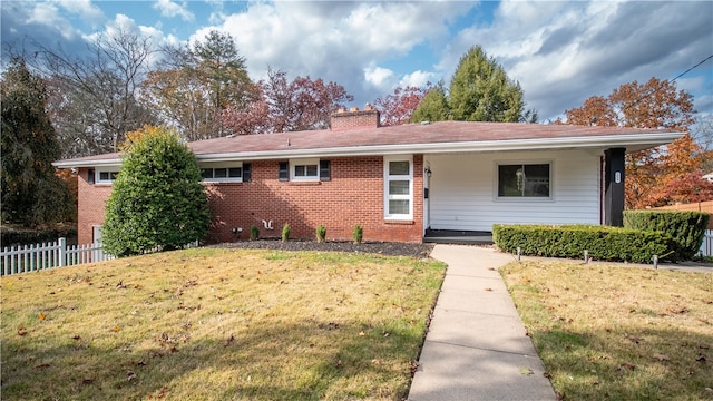 ranch-style home with a front lawn