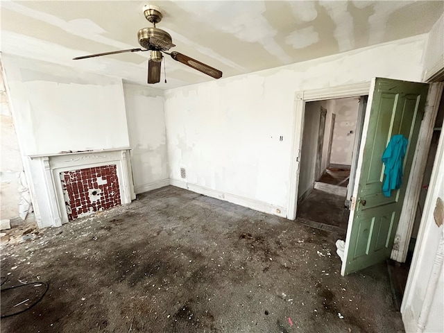 unfurnished living room with ceiling fan