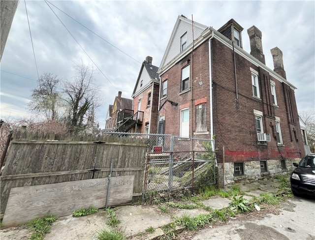 view of home's exterior with cooling unit