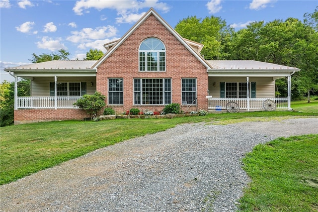 view of property with a front yard and a porch