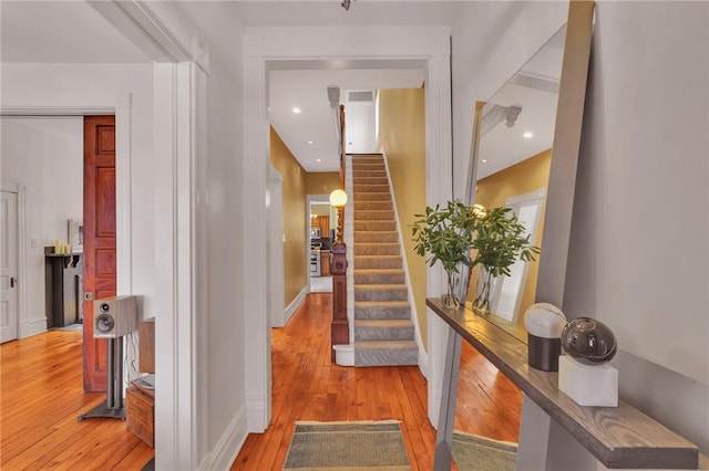 110 Pius St, South Side, PA 15203 - foyer entrance featuring light wood-style flooring, stairs, baseboards, and recessed lighting
