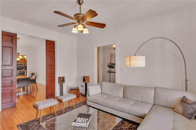 110 Pius St, South Side, PA 15203 - living room with ceiling fan and light wood finished floors