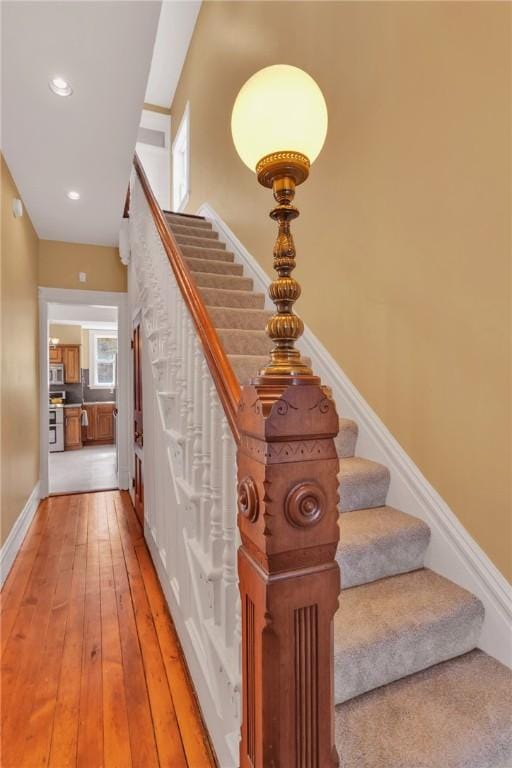 110 Pius St, South Side, PA 15203 - stairs with hardwood / wood-style floors, recessed lighting, and baseboards