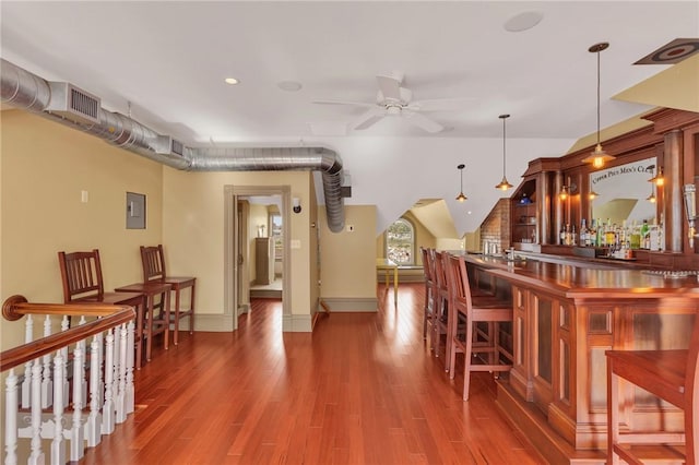 110 Pius St, South Side, PA 15203 - indoor dry bar with a ceiling fan, electric panel, wood finished floors, pendant lighting, and baseboards