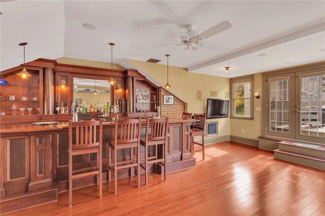 110 Pius St, South Side, PA 15203 - indoor wet bar featuring wood finished floors, a ceiling fan, decorative light fixtures, and baseboards