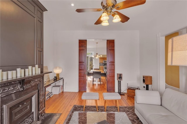 110 Pius St, South Side, PA 15203 - living room with a ceiling fan and light wood-style flooring