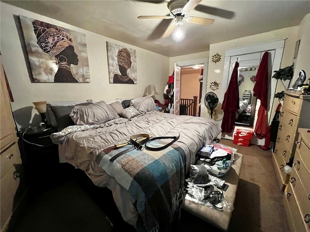 carpeted bedroom with a closet and ceiling fan