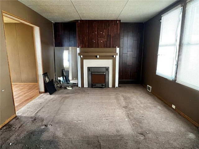 1229 Main St, Aliquippa, PA 15001 - unfurnished living room with carpet flooring, a fireplace, and baseboards