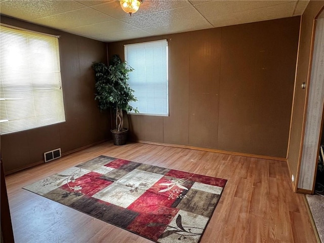 1229 Main St, Aliquippa, PA 15001 - empty room featuring wood finished floors and a paneled ceiling