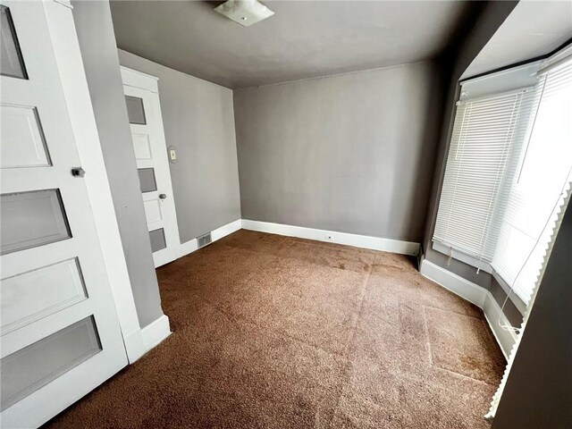 1229 Main St, Aliquippa, PA 15001 - empty room with carpet and baseboards