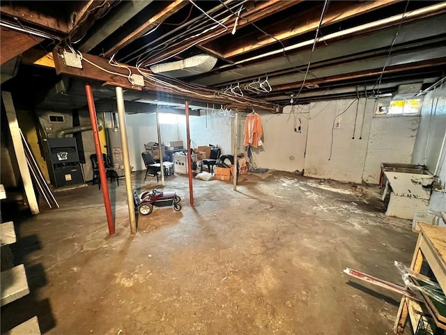 1229 Main St, Aliquippa, PA 15001 - below grade area with heating unit and healthy amount of natural light