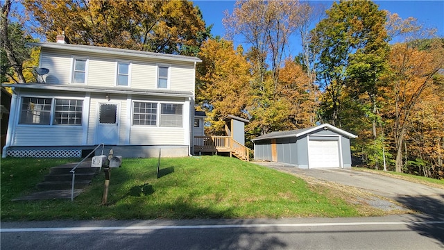 view of front of property with an outdoor structure, a garage, and a front lawn