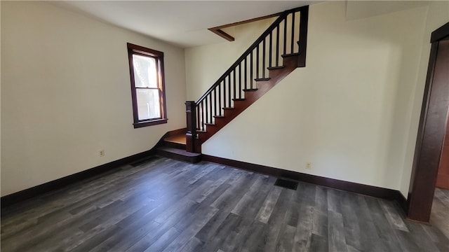 staircase featuring wood-type flooring