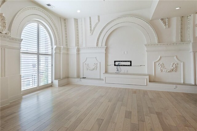 unfurnished living room featuring light hardwood / wood-style floors