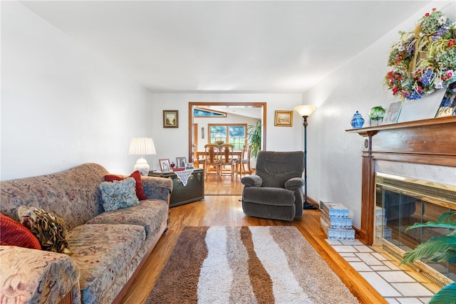 living room featuring light hardwood / wood-style floors and a fireplace