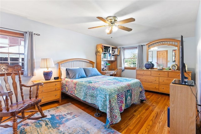 bedroom featuring dark hardwood / wood-style floors and ceiling fan