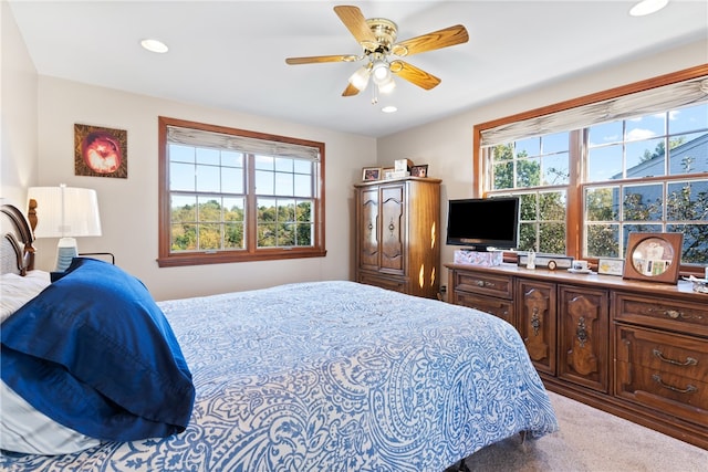 carpeted bedroom with ceiling fan