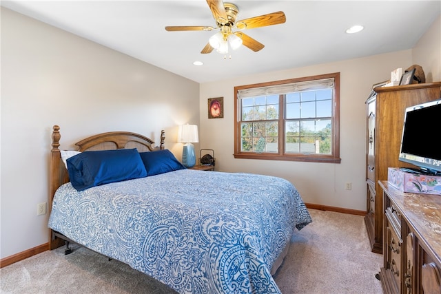 bedroom with light colored carpet and ceiling fan