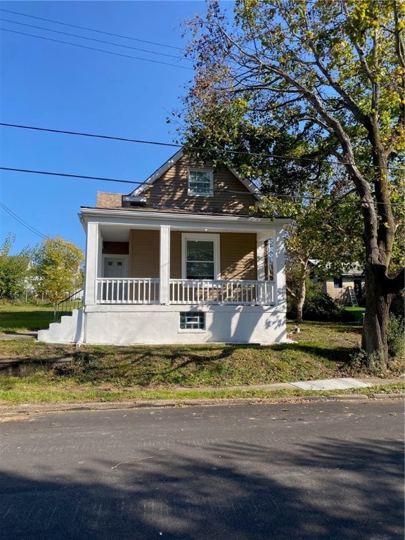 bungalow-style home with a porch