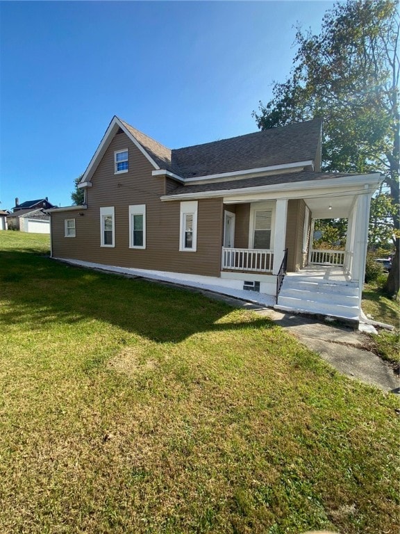 exterior space with a porch and a yard