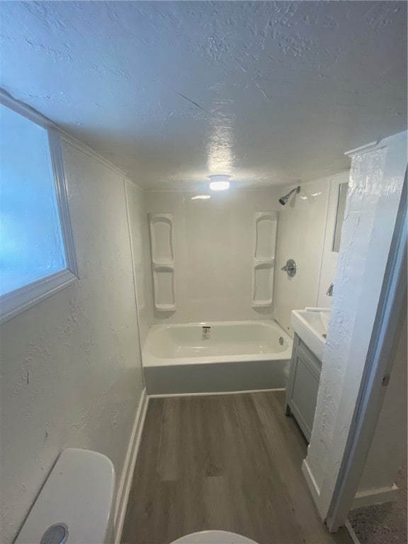 full bathroom with wood-type flooring, vanity, toilet, and shower / bath combination