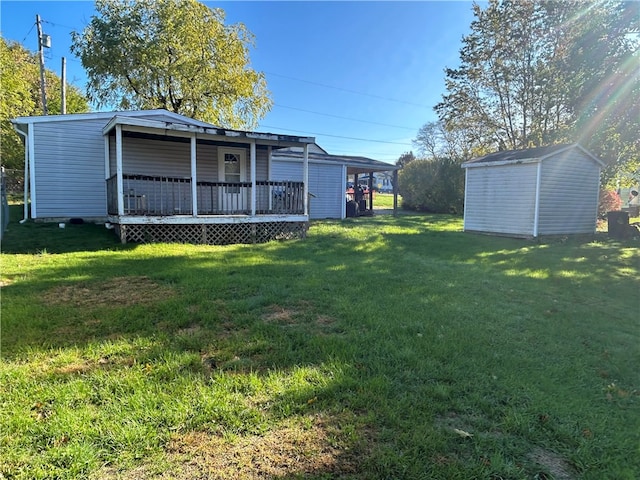 view of yard with a wooden deck and a shed