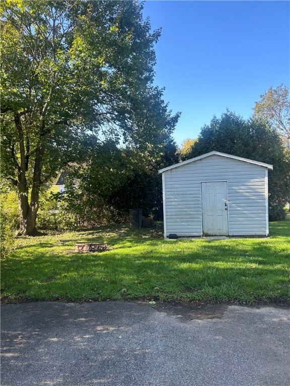 view of outdoor structure with a lawn