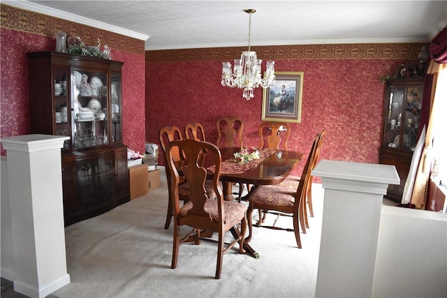 dining room with crown molding, carpet, and an inviting chandelier