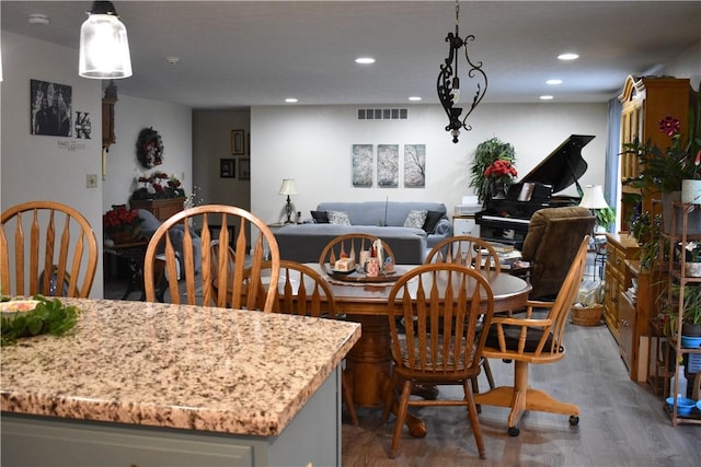 dining area with hardwood / wood-style floors