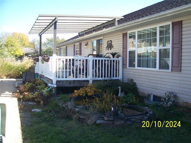 view of side of home with a deck