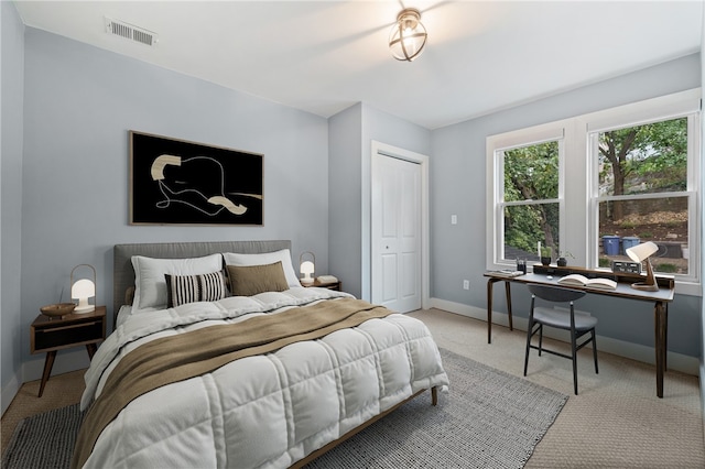 carpeted bedroom featuring a closet