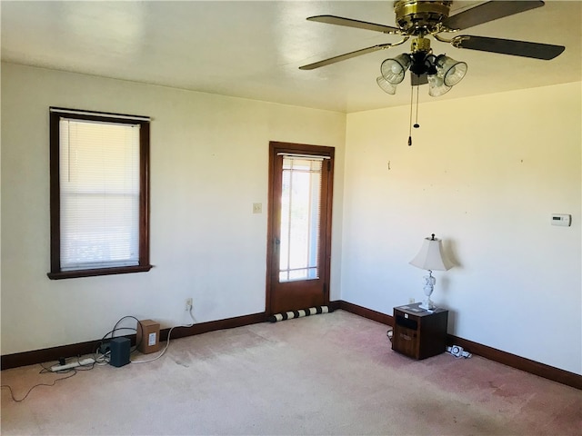 empty room with light carpet and ceiling fan