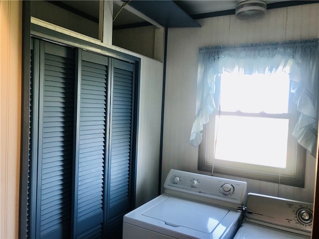 laundry area featuring washing machine and clothes dryer