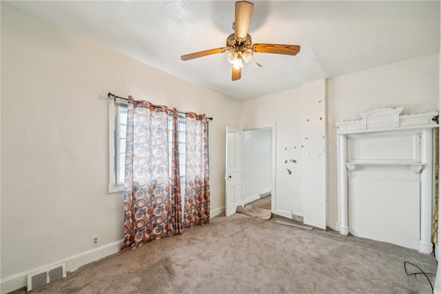 unfurnished bedroom with light carpet and ceiling fan