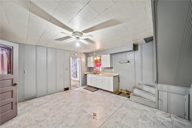 interior space featuring vanity and ceiling fan