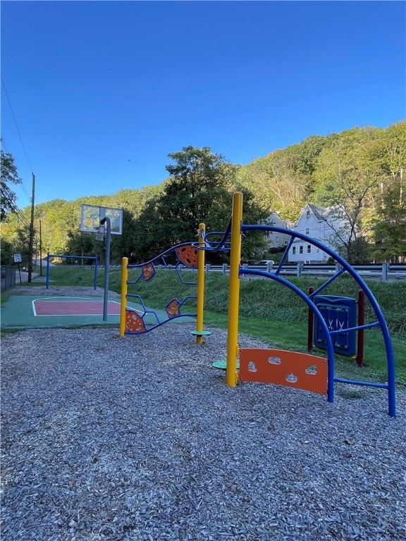 view of play area with basketball hoop