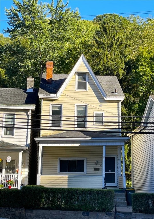 view of front of house with a balcony