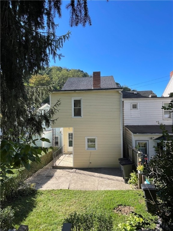 back of house with a patio area