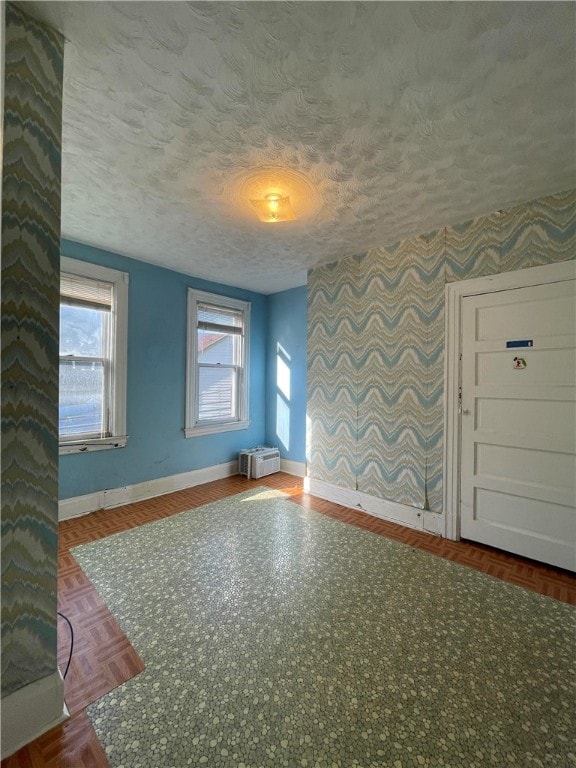 spare room featuring a textured ceiling