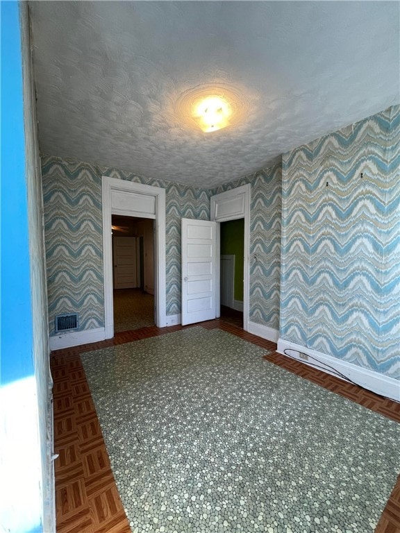 empty room featuring parquet floors