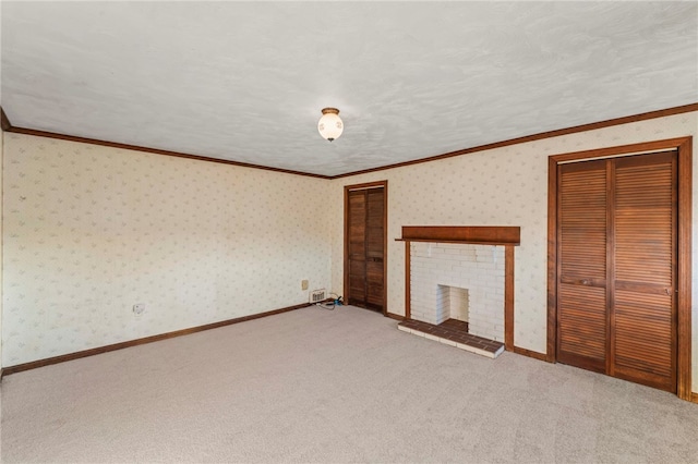 unfurnished bedroom with carpet, ornamental molding, a textured ceiling, a fireplace, and a closet