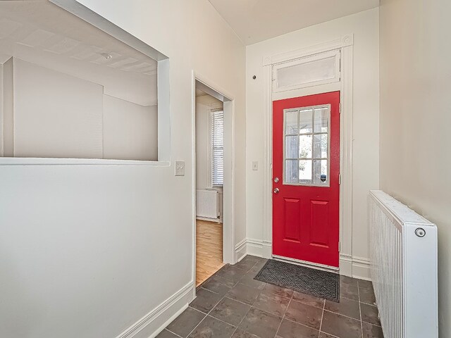 entryway featuring radiator