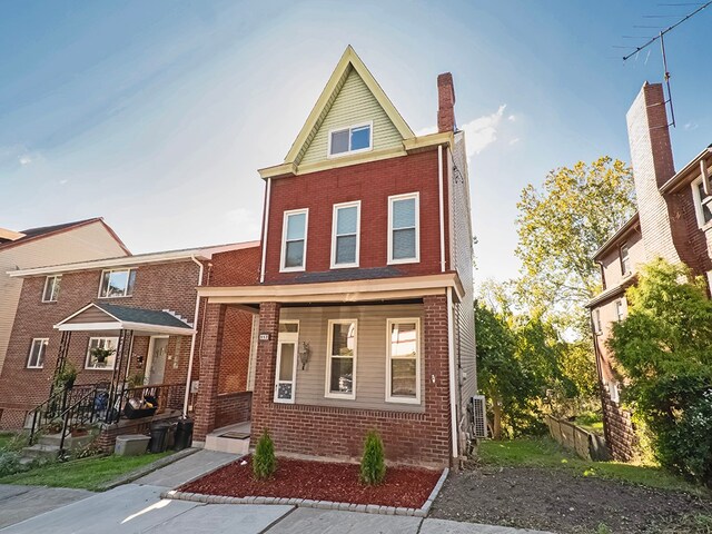 view of front of property featuring a porch and central AC unit