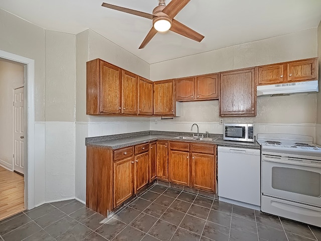 kitchen featuring sink, white appliances, and ceiling fan