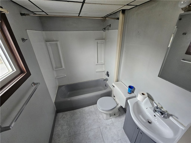 full bathroom featuring a paneled ceiling, toilet, shower / bathtub combination, vanity, and tile patterned floors