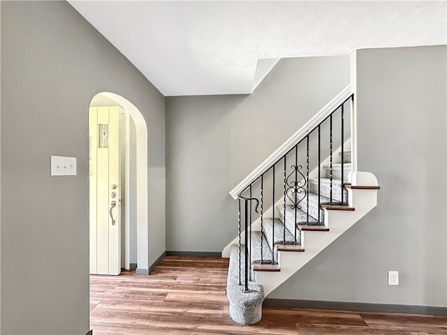 entryway with hardwood / wood-style flooring