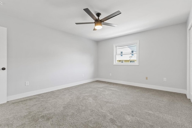 empty room with ceiling fan and carpet flooring