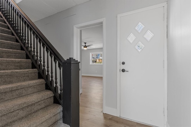 entryway featuring ceiling fan and wood-type flooring